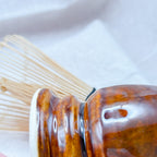 Close-up of a Japanese matcha bamboo whisk holder